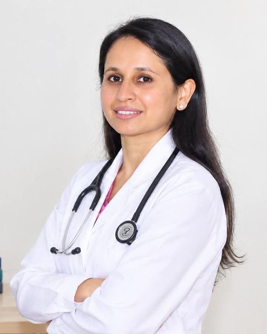 Dr. Sushma Dhakal, fetal medicine specialist in Kathmandu, Nepal, in a white coat with stethoscope
